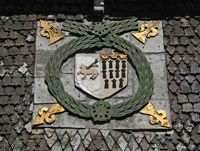 The central coat of arms on the Tudor House