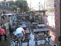Cleaning up the beer garden after the 2000 floods