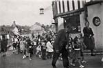 Children parade by the post office - 1950s