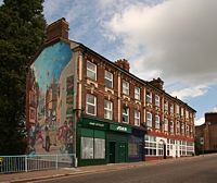 The block of houses with the mural.