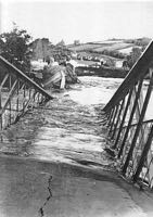 The roadway submerged beneath the river