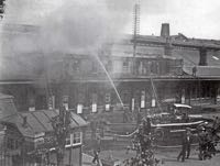 The wooden Queen Street Station on fire