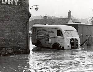 A County Steam Laundry van in a flood
