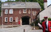 The Bishops Palace entrance and a friendly Red Coat