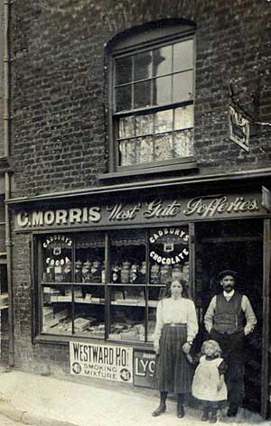George Morris outside his shop