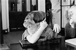Cuddling a stuffed rabbit